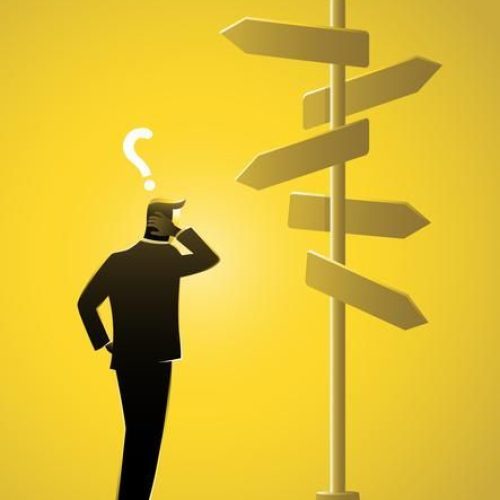 Entrepreneur confused by different traffic signs and a question mark_